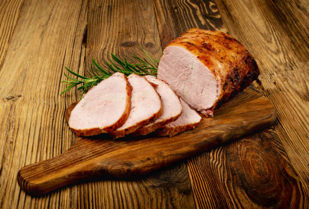 Baked Pork Cuts, Roasted Sliced Loin, Tenderloin Ham Piece Baked Pork Slices on Wooden Table. Roasted Sliced Loin, Tenderloin Ham Piece, Baked Meat Fillet on Wood Rustic Background smoked pork stock pictures, royalty-free photos & images