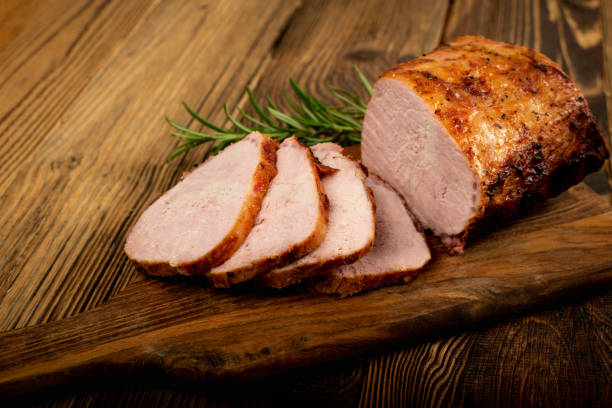 Baked Pork Cuts, Roasted Sliced Loin, Tenderloin Ham Piece Baked Pork Slices on Wooden Table. Roasted Sliced Loin, Tenderloin Ham Piece, Baked Meat Fillet on Wood Rustic Background loin stock pictures, royalty-free photos & images