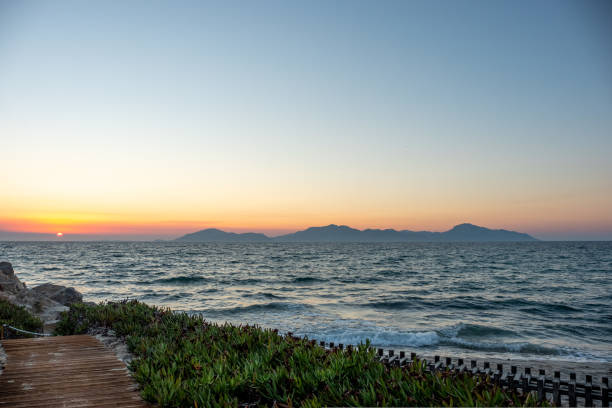 Panorama of the coast and an idyllic path along the coast of Kos at sunset