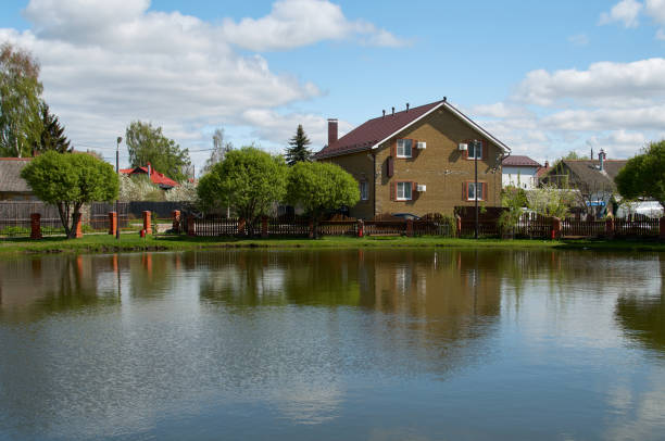 istock Two-story brick house on the lake 1440455164