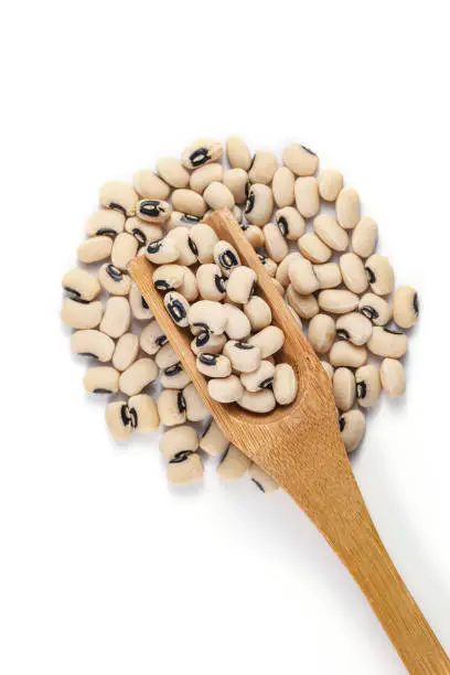 Photo of Black Eye Pea (Lobia, Cowpeas). Black Eye Pea with wooden spoon