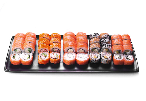 Japanese food restaurant sushi maki roll plate or platter set isolated on white background side view