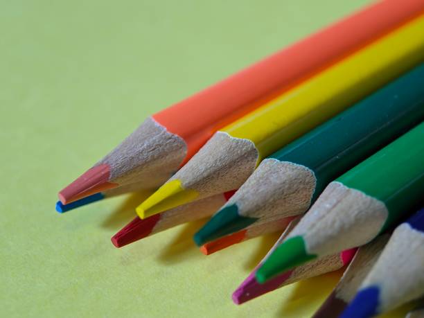 istock Close-up of colored pencils on yellow background 1440460034