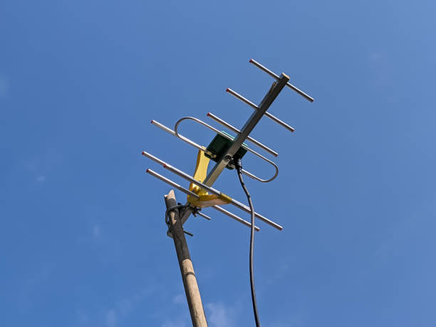istock Tv antenna on clear blue sky 1440461655