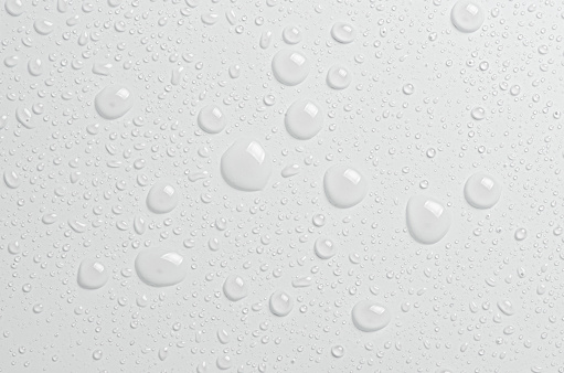 Drops of cosmetic micellar water or tonic. Closeup, macro photography.