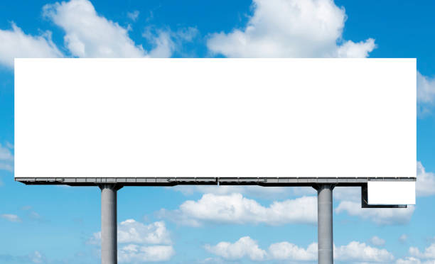 istock Outdoor billboard on blue sky background with clipping path 1440464162
