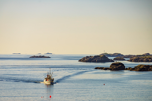 Seascape with fishing boat Lofoten archipelago, Norway
