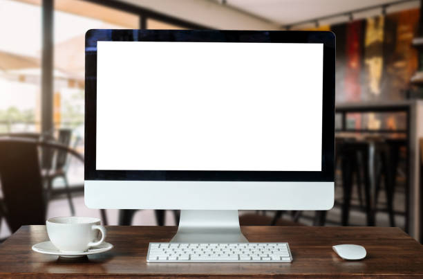 istock Computer Monitor, Keyboard, coffee cup smartphone, tablet, and Mouse with Blank or White Screen Isolated is on the work table in the coffeeshop 1440464531