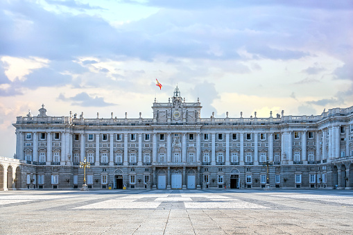 Madrid, Spain - July 19, 2022: Facade of the Royal Palace. The old building is a major tourist attraction in the Spanish capital city.