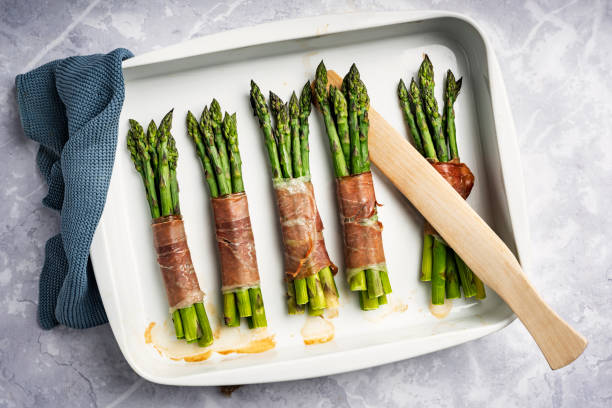 istock Baked Asparagus Wrapped With Parma Ham. 1440465734