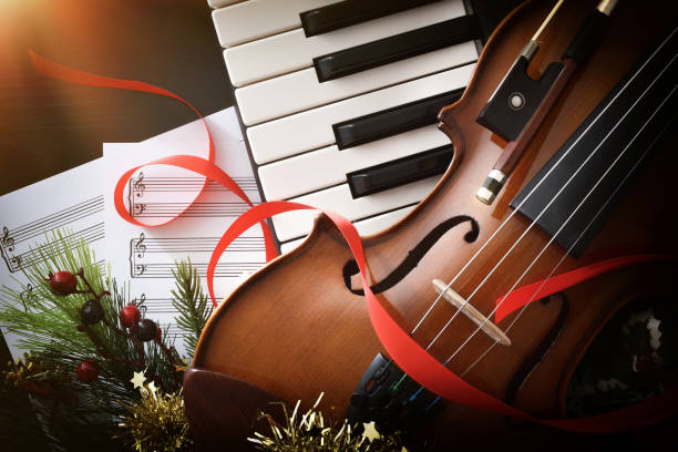 Christmas musical event with piano and violin close up stock photo