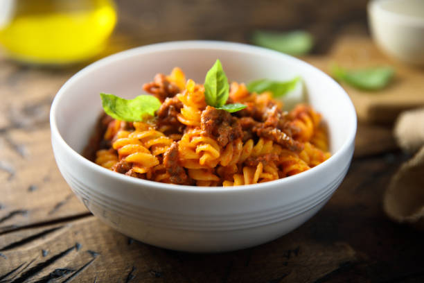 Pasta with Bolognese sauce Pasta with traditional Bolognese sauce fusilli stock pictures, royalty-free photos & images
