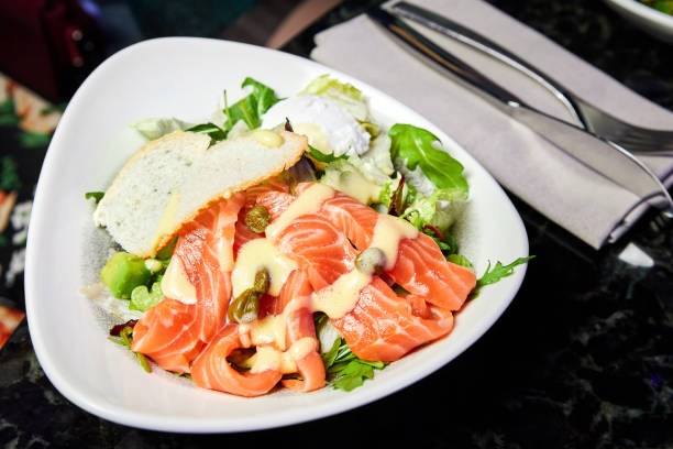 istock Salad from Norwegian salmon, poached egg and hollandaise sauce 1440468896