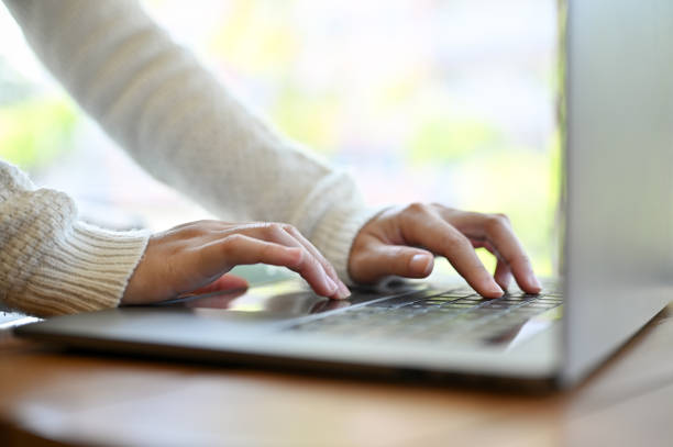 istock A female hands typing on laptop keyboard, using laptop, working on her tasks. cropped shot 1440470876