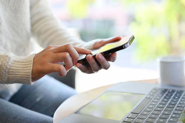 istock A female remote working at the coffee shop, using her smartphone to chat with someone. cropped 1440471004