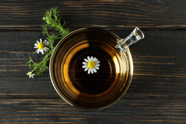 istock Cup of chamomile tea on rustic wooden table 1440471514