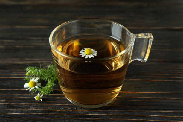 istock Cup of chamomile tea on rustic wooden table 1440471701