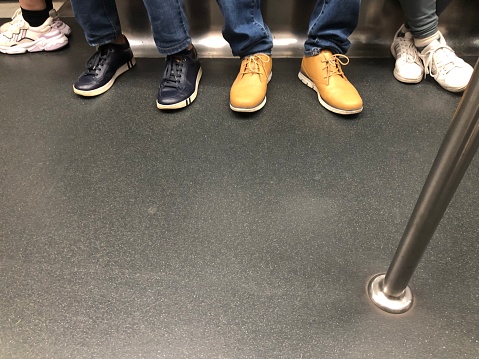 People and shoes in metro