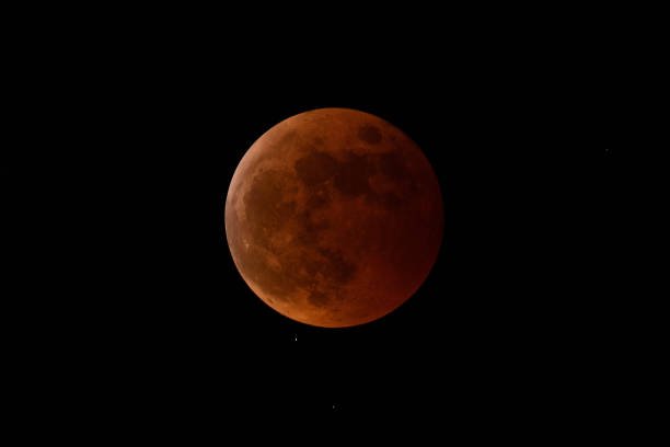 istock A copper-colored total lunar eclipse completely in the shadow of the earth. 1440471860
