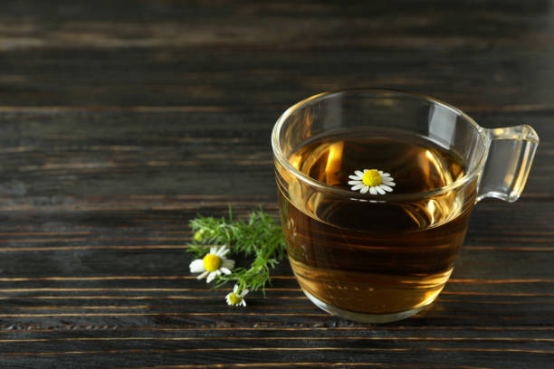 istock Cup of chamomile tea on rustic wooden table 1440473183