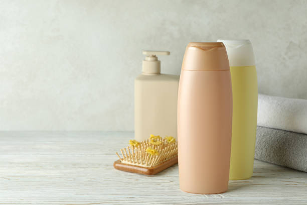 istock Hair care accessories on white wooden table 1440474468