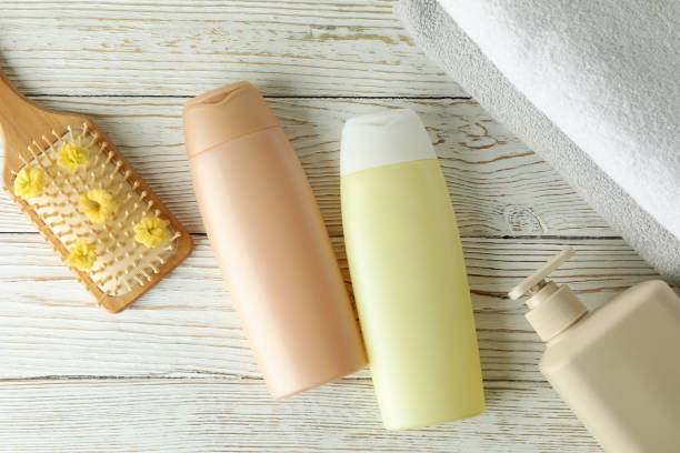 istock Hair care accessories on white wooden table 1440474540