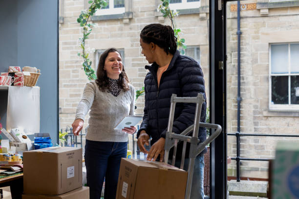 istock Delivery Driver and Shop Owner Talking 1440474595