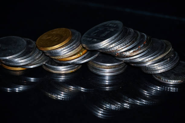 istock indian coin currency collection gold and silver. 1440474942