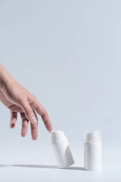 istock Two bottles for cosmetics without a logo on a light background. Mockup cosmetics 1440475966