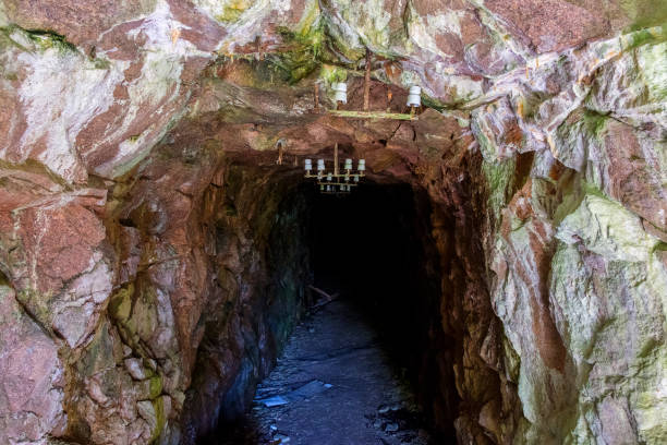 istock Dark old mine carved in the mountain 1440476174