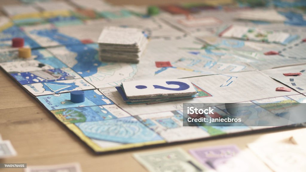 Board game on the floor. Ready to play Colorful board game with dice and cards set on the floor. Waiting for players. Board Game Stock Photo