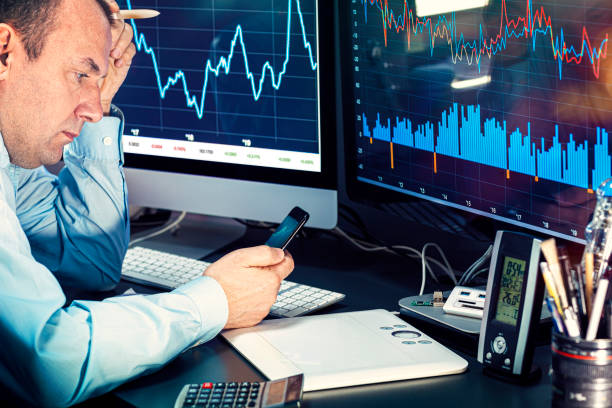istock Businessman checking stock market data. He using a mobile phone. Analysis economy data on forex earn graph 1440478145