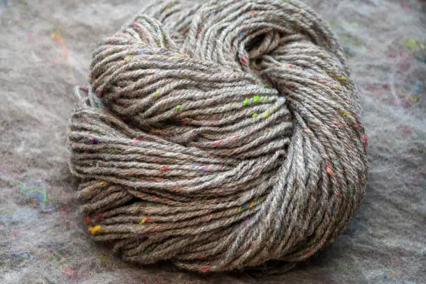 Beautiful skein of colourful handdyed handspun yarn for knitting.