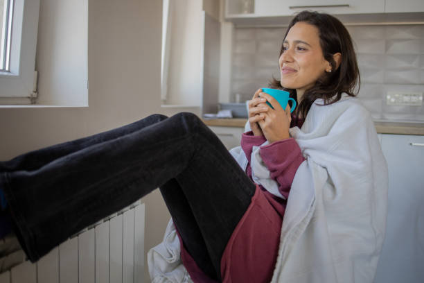 istock Woman feel cold in home with no heating 1440481268