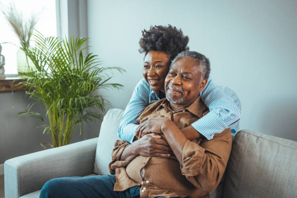 istock Loving father and daughter together on sofa. 1440482907