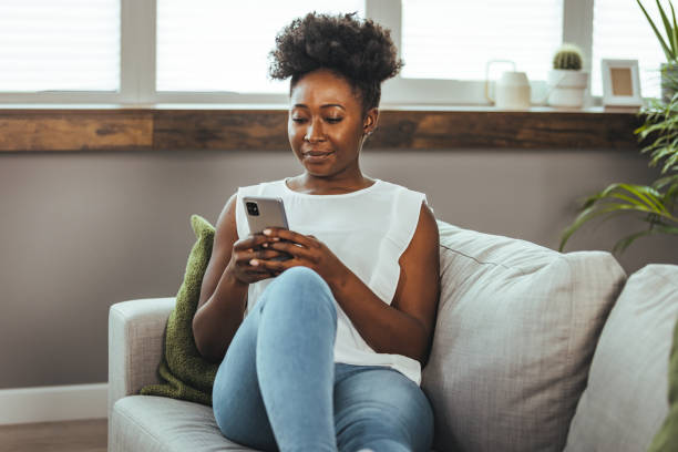 istock Keeping her social media fans updated 1440483833