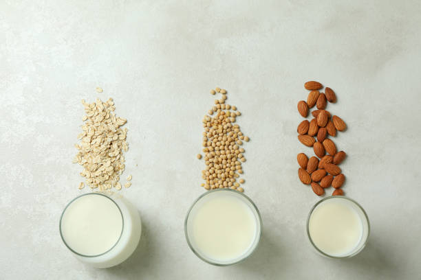 istock Concept of vegan milk on white textured background 1440484532