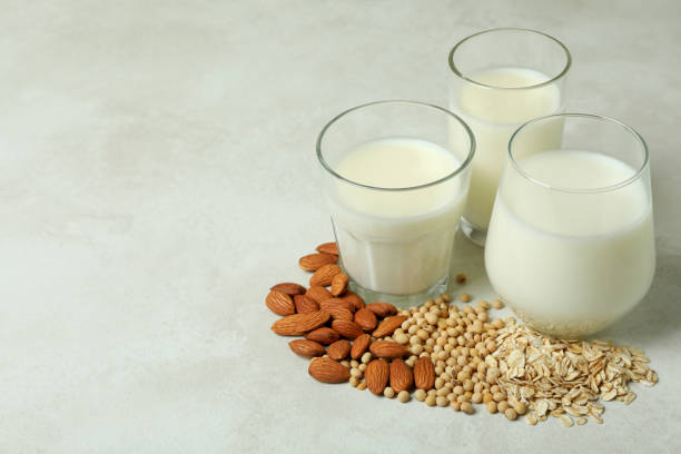 istock Concept of vegan milk on white textured background 1440484551