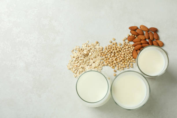 istock Concept of vegan milk on white textured background 1440485400