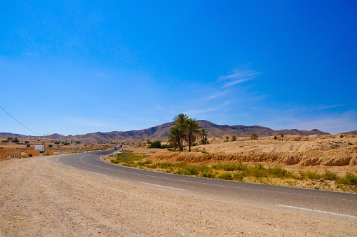 Road in Sahara desert in Tunisia, North Africa.