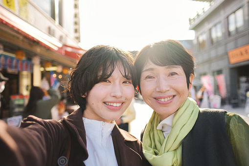 Mother and z-generation daughter enjoying the trip in Enoshima Island, Kanagawa prefecture, Japan