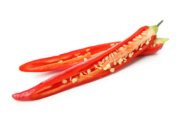 istock Red hot chili pepper halves isolated on white background 1440487909