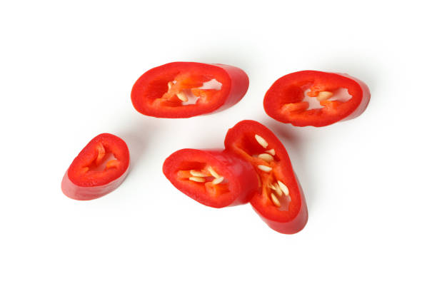istock Red hot chili pepper slices isolated on white background 1440488623