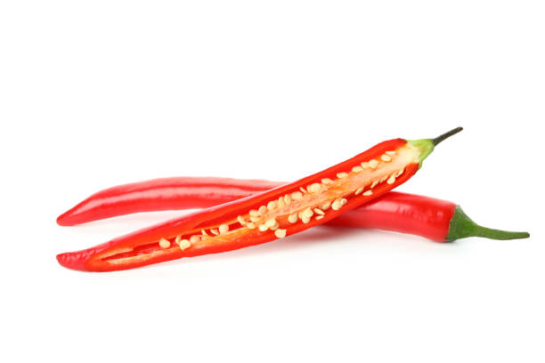 istock Red hot chili pepper halves isolated on white background 1440488660