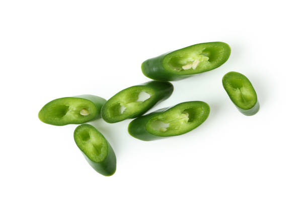 istock Green hot chili pepper slices isolated on white background 1440488688