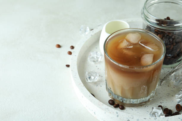 istock Concept of cooking ice coffee on white textured table 1440489670