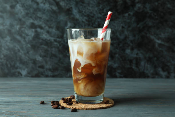 istock Concept of cold drink with ice coffee on wooden table 1440489893