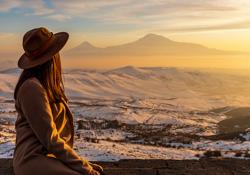 Young tourist looking at the sunset.Mount Ararat