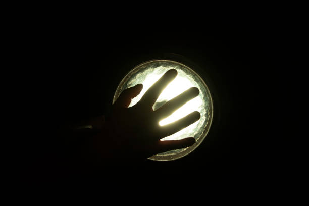 A hand touches a colorful digital screen