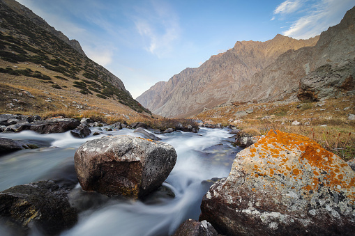 A small fast river high in the mountains. Tien Shan mountain landscape.
